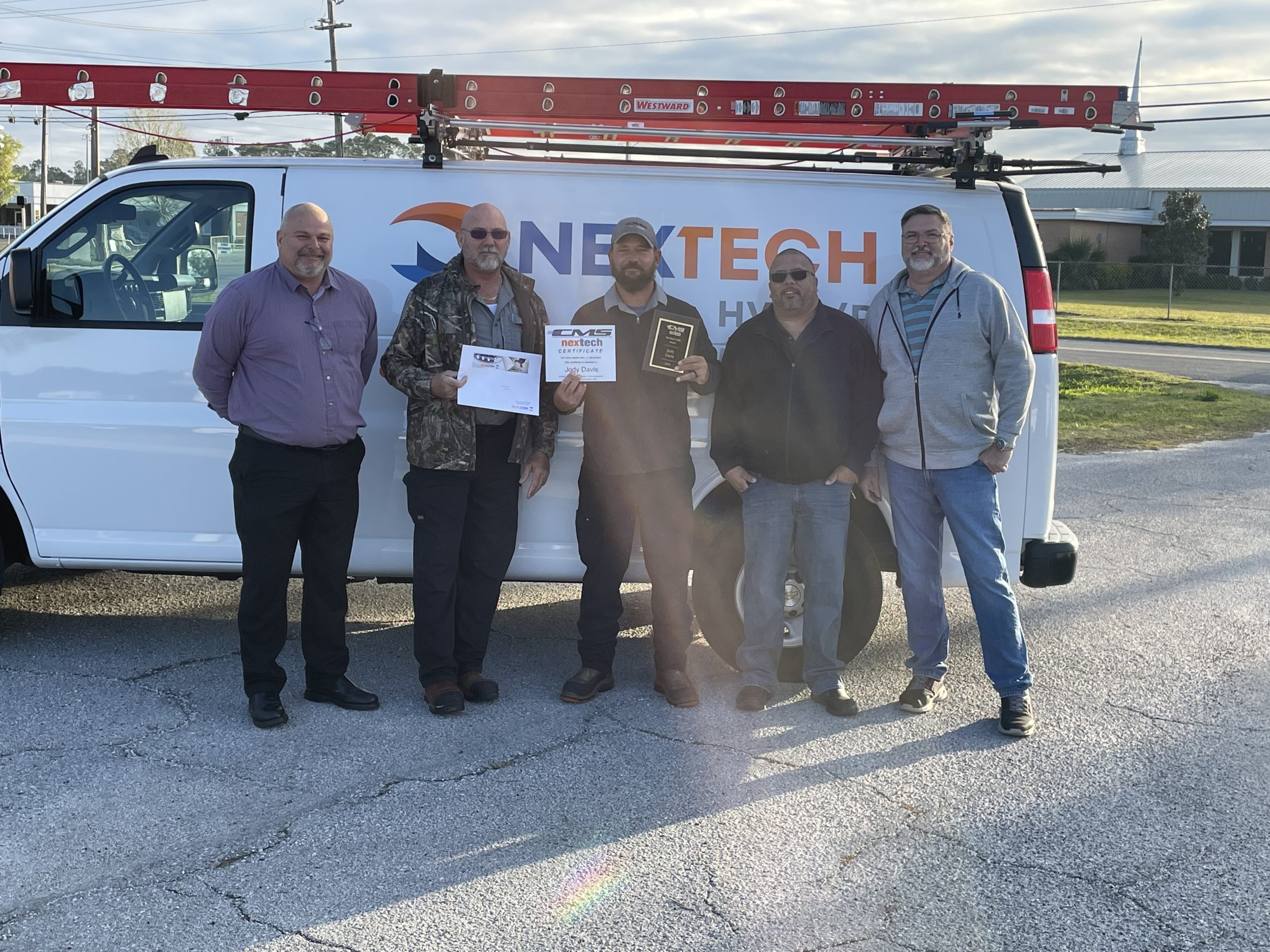 The image showcases a branded commercial vehicle, prominently displaying the NexTech logo, which is used for advertising HVAC services. This vehicle serves as a mobile advertisement, reaching potential customers in various locations and reinforcing brand visibility in the community.