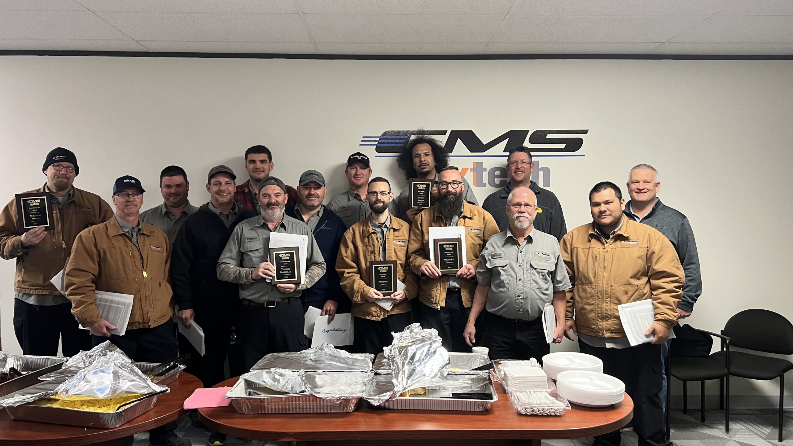 The image depicts a team of HVAC professionals engaged in a job at an event, showcasing their skills in installation and maintenance. This highlights NexTech's commitment to delivering high-quality HVAC services and their expertise in the industry.