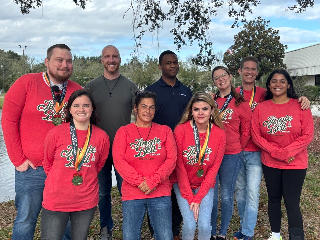 The image captures a joyful social group of young individuals, showcasing their smiles and camaraderie. This reflects the community-oriented approach of NexTech in the HVAC industry, emphasizing teamwork and customer satisfaction.